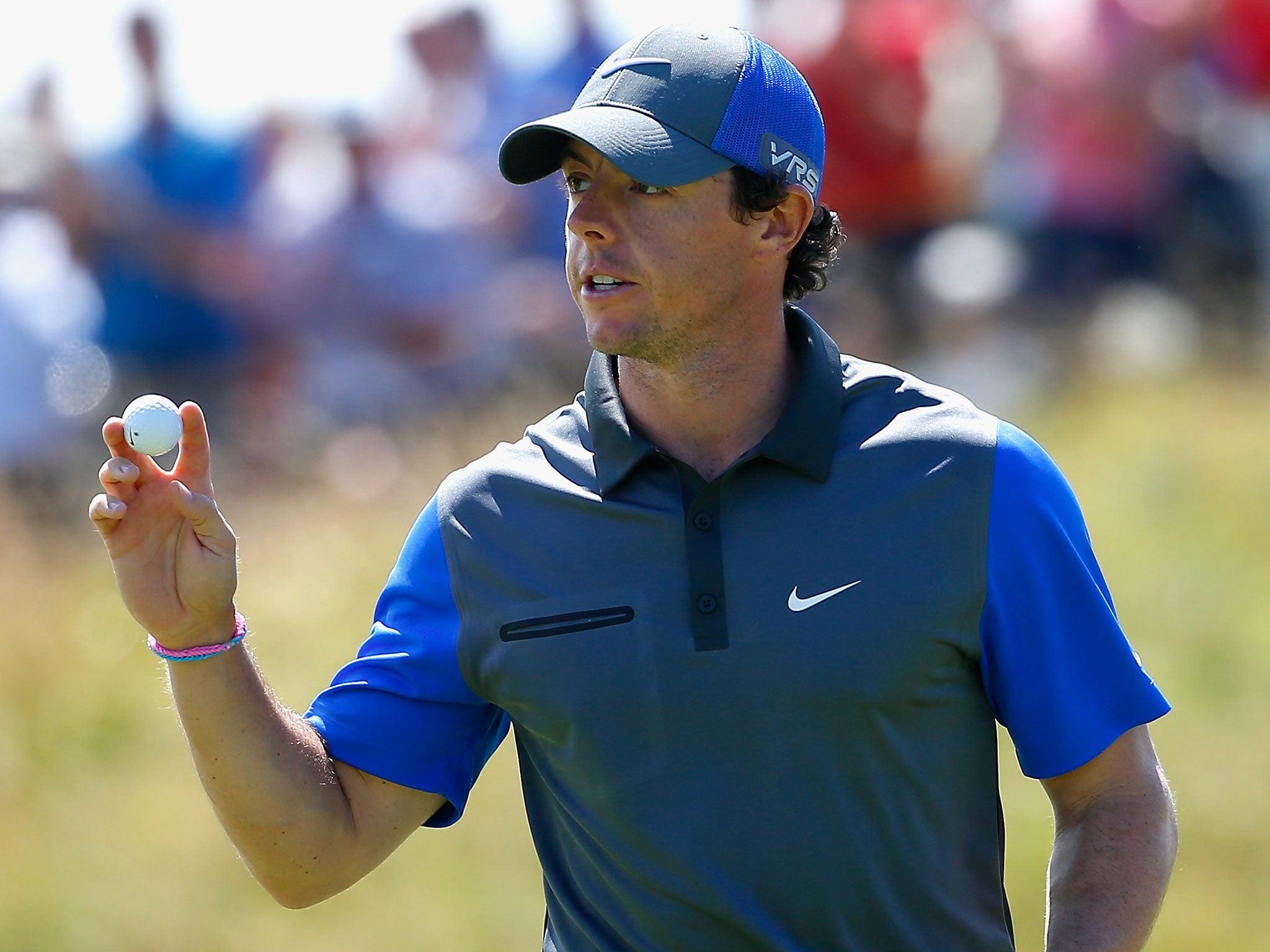 Rory McIlroy of Northern Ireland waves to the gallery during the first round of The 143rd Open Championship at Royal Liverpool on July 17, 2014 in Hoylake, England.