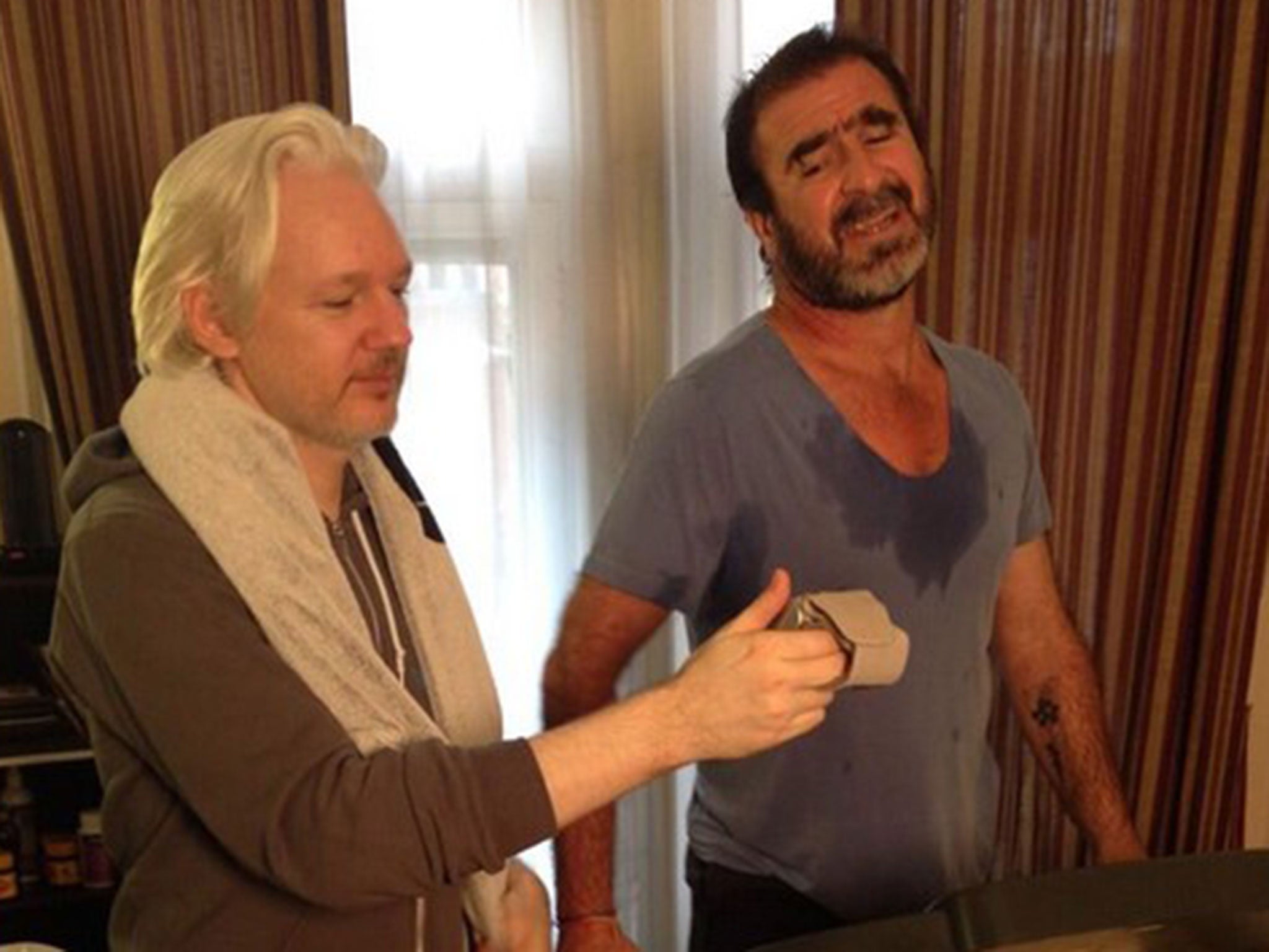 Julian Assange working out with Eric Cantona