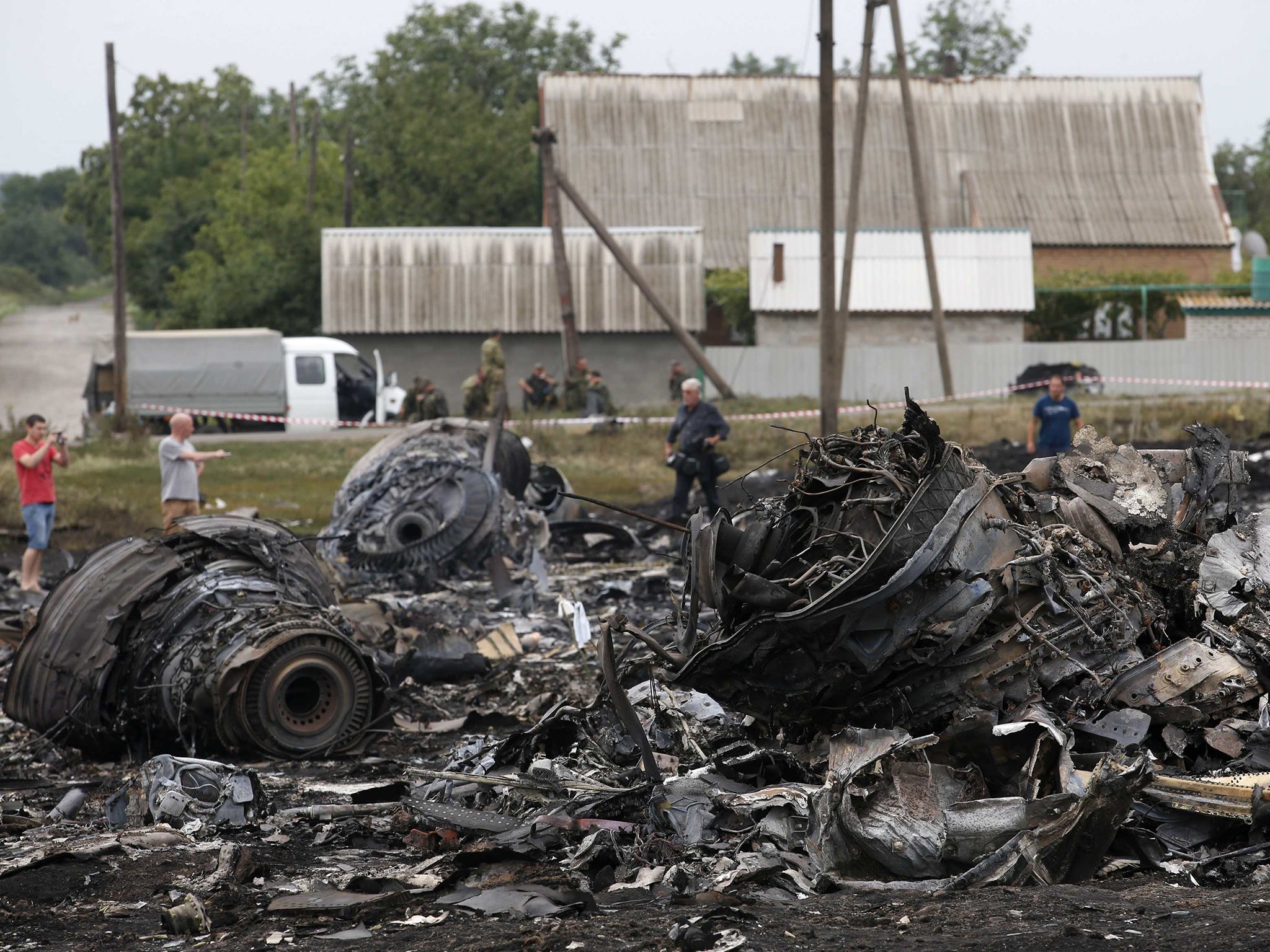 Debris is seen at the site of Malaysia Airlines Boeing 777 plane crash near the settlement of Grabovo, in the Donetsk region