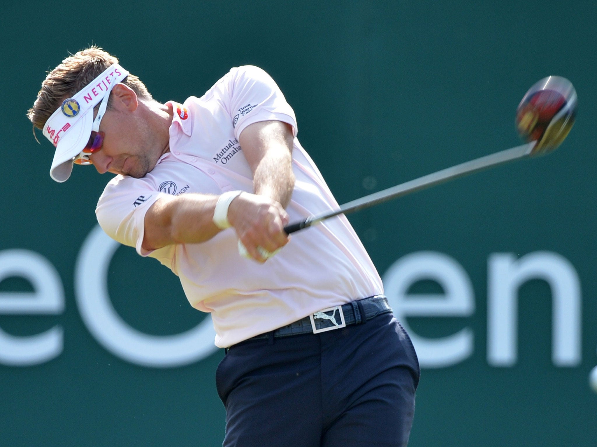 Ian Poulter plays from the 1st tee during his first round at Royal Liverpool yesterday