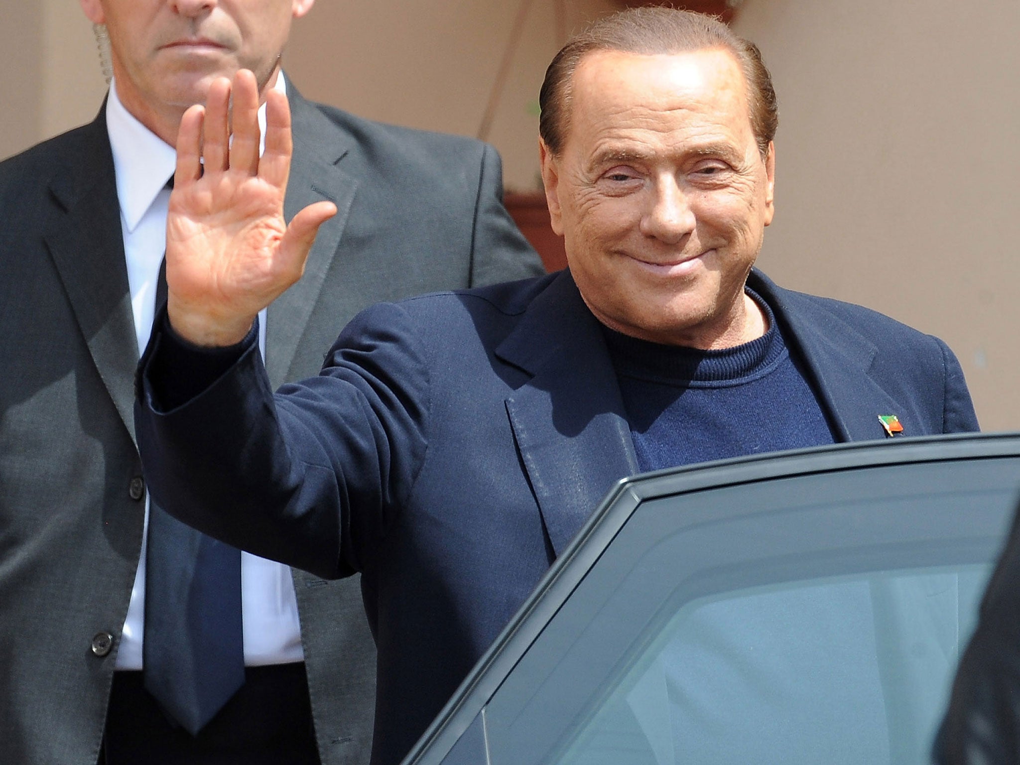 Silvio Berlusconi leaves the Fondazione Sacra Famiglia on May 9, 2014 in Milan, Italy.