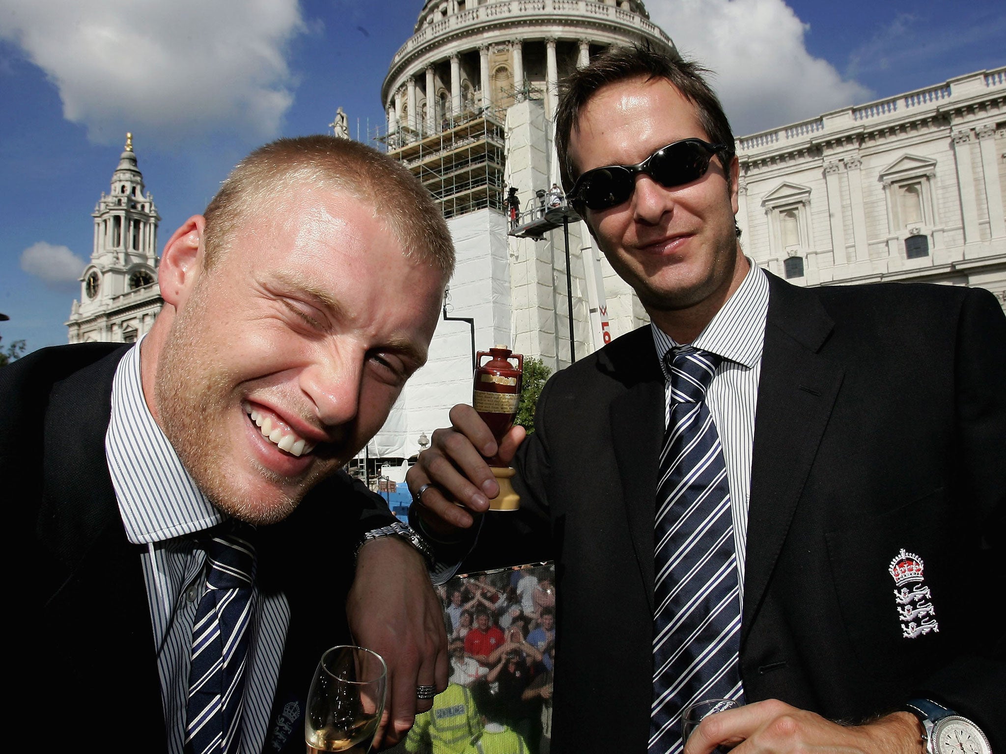 Andrew Flintoff (left) looks worse for wear celebrating Ashes glory with Michael Vaughan in
2005