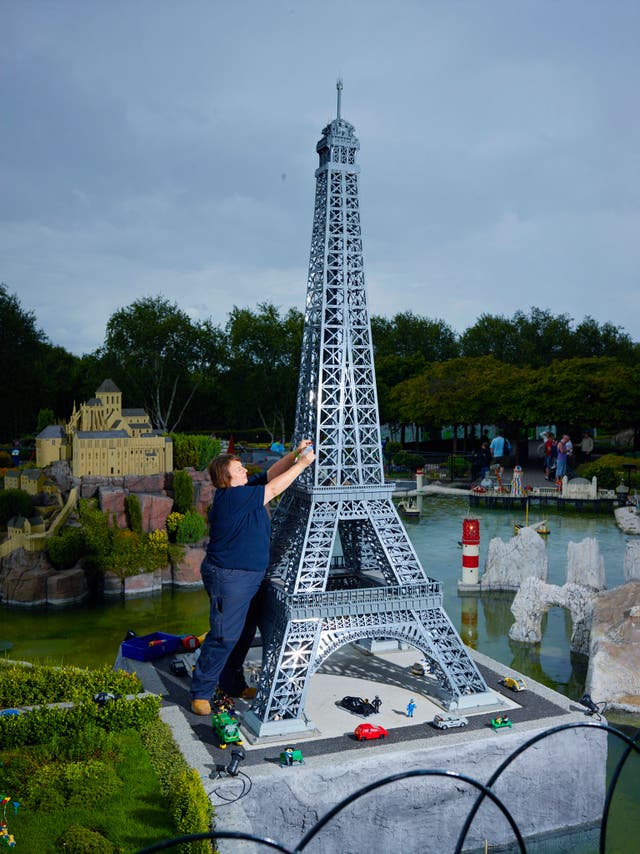 The theme park's model of the Eiffel Tower is four metres tall (about one-eightieth its real size) and is made from 230,000 bricks