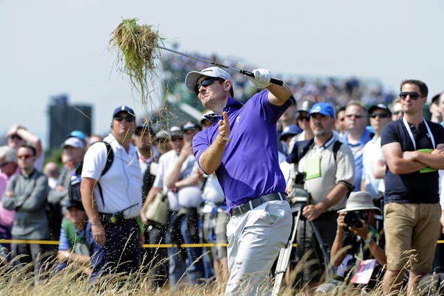 Justin Rose brings in the harvest as he plays out of the rough at the seventh yesterday