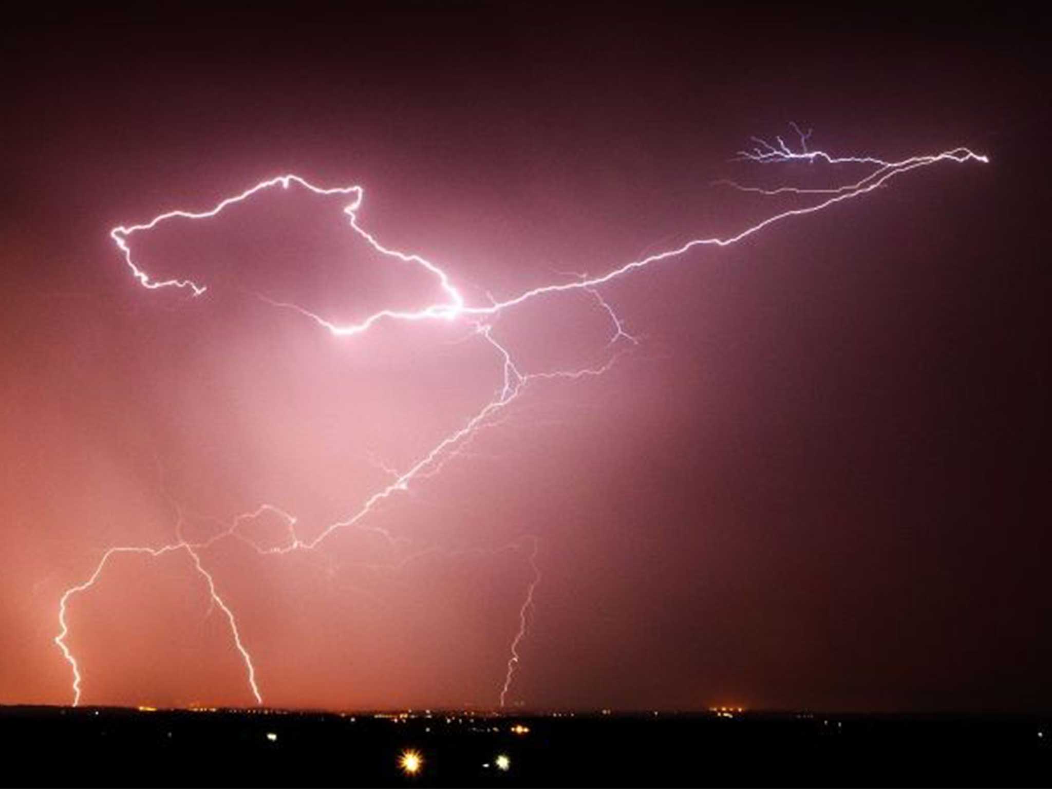 Lightning strikes over the Vale of Belvoir, Leicestershire as the UK is now braced for torrential downpours and storms that will could cause flash flooding across large parts of England and Wales