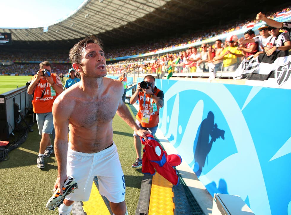 Frank Lampard gives his boots to fans in Brazil after England's World Cup elimination