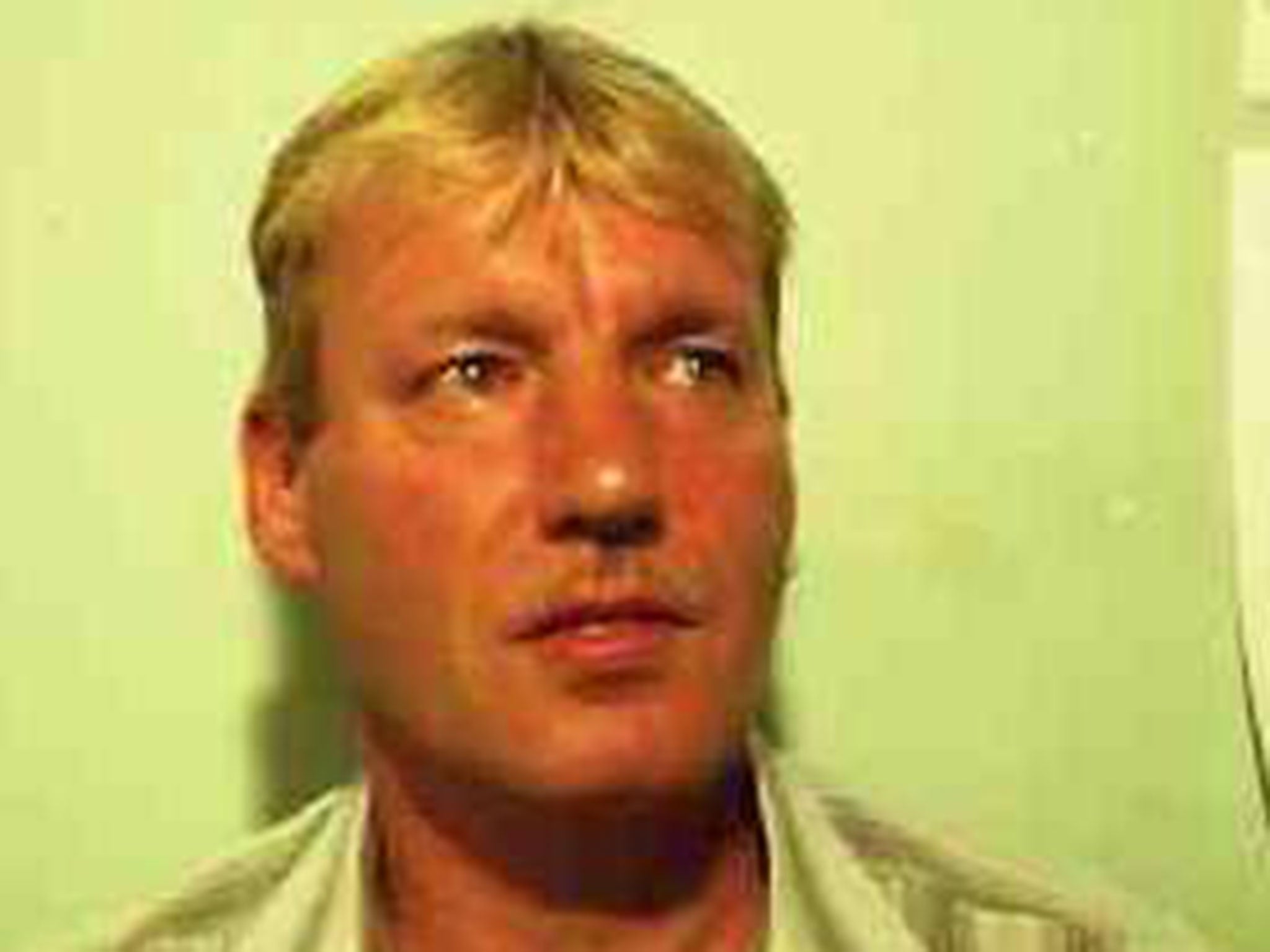 John Heald, 53, of South Yorkshire, is wanted by police in connection with the murder of a woman at a guest house.