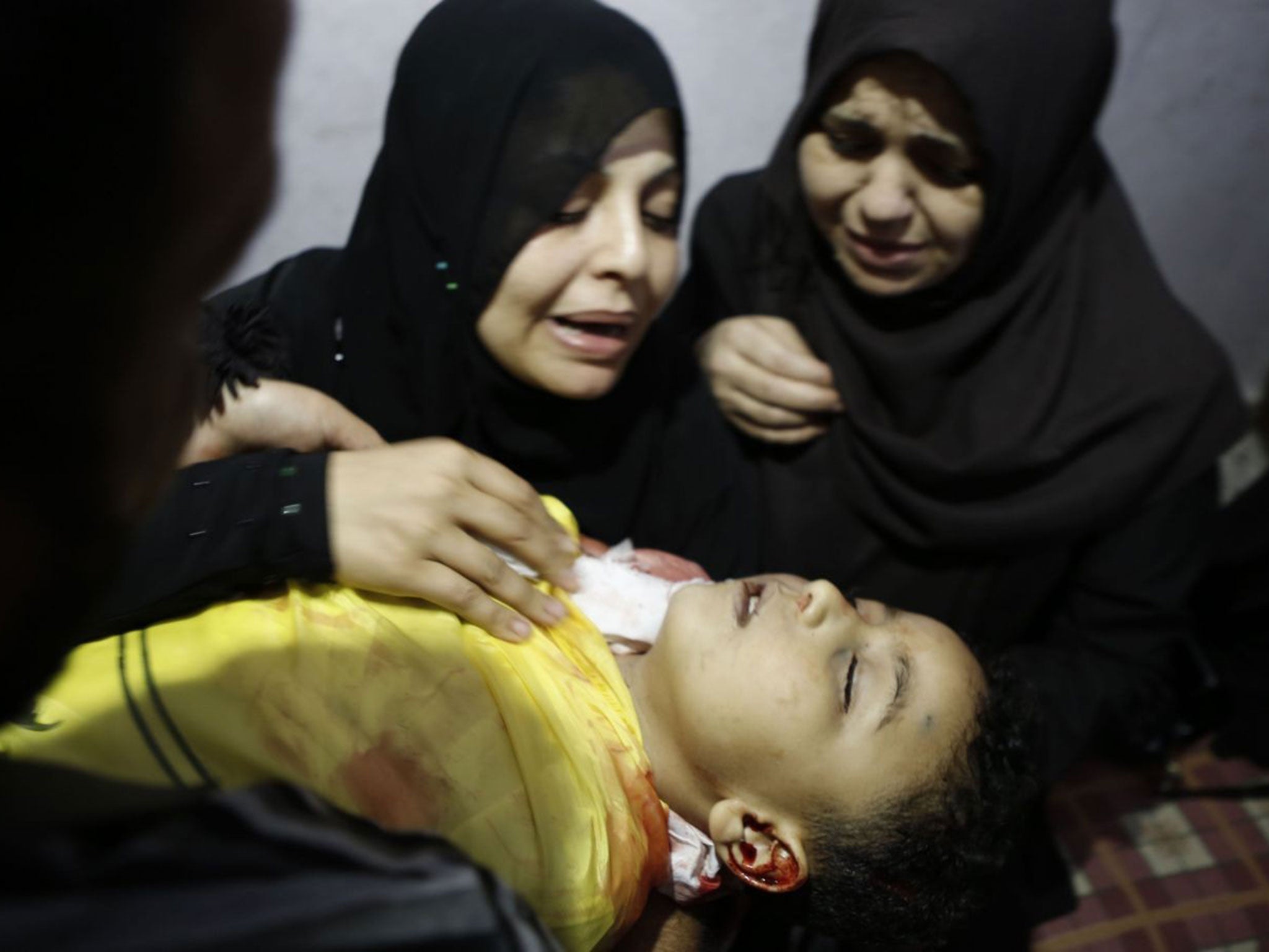 Innocents’ tears: A mother yesterday mourns her son killed by an Israeli tank shell in Gaza