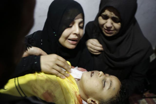 Innocents’ tears: A mother  yesterday mourns her son killed by an Israeli tank shell in Gaza