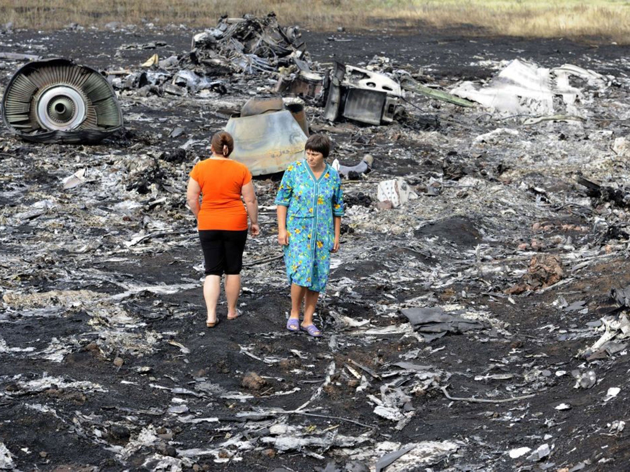Air horror: Local people roam the wreck of MH17