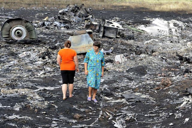 Air horror: Local people roam the wreck of MH17