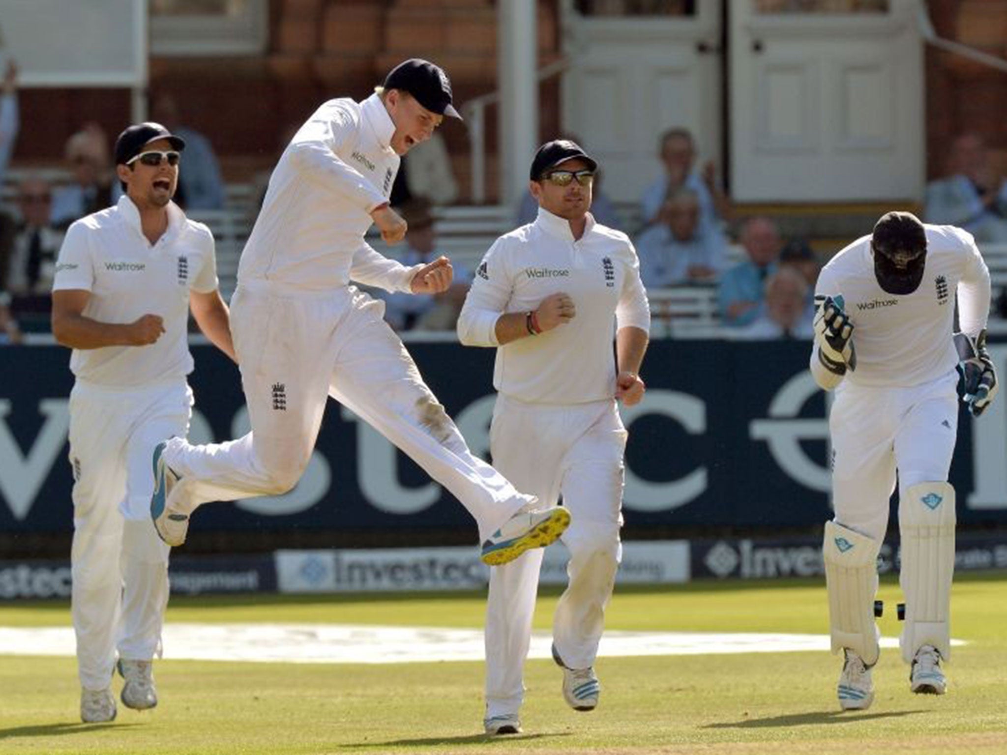 Cook, Joe Root and Ian Bell celebrate after Matt Prior took the catch of India's Cheteshwar Pujara