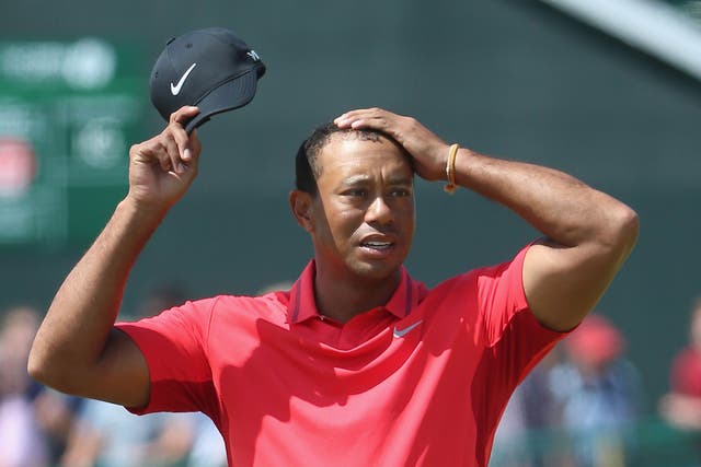 Tiger Woods looks on at the 18th hole on Sunday