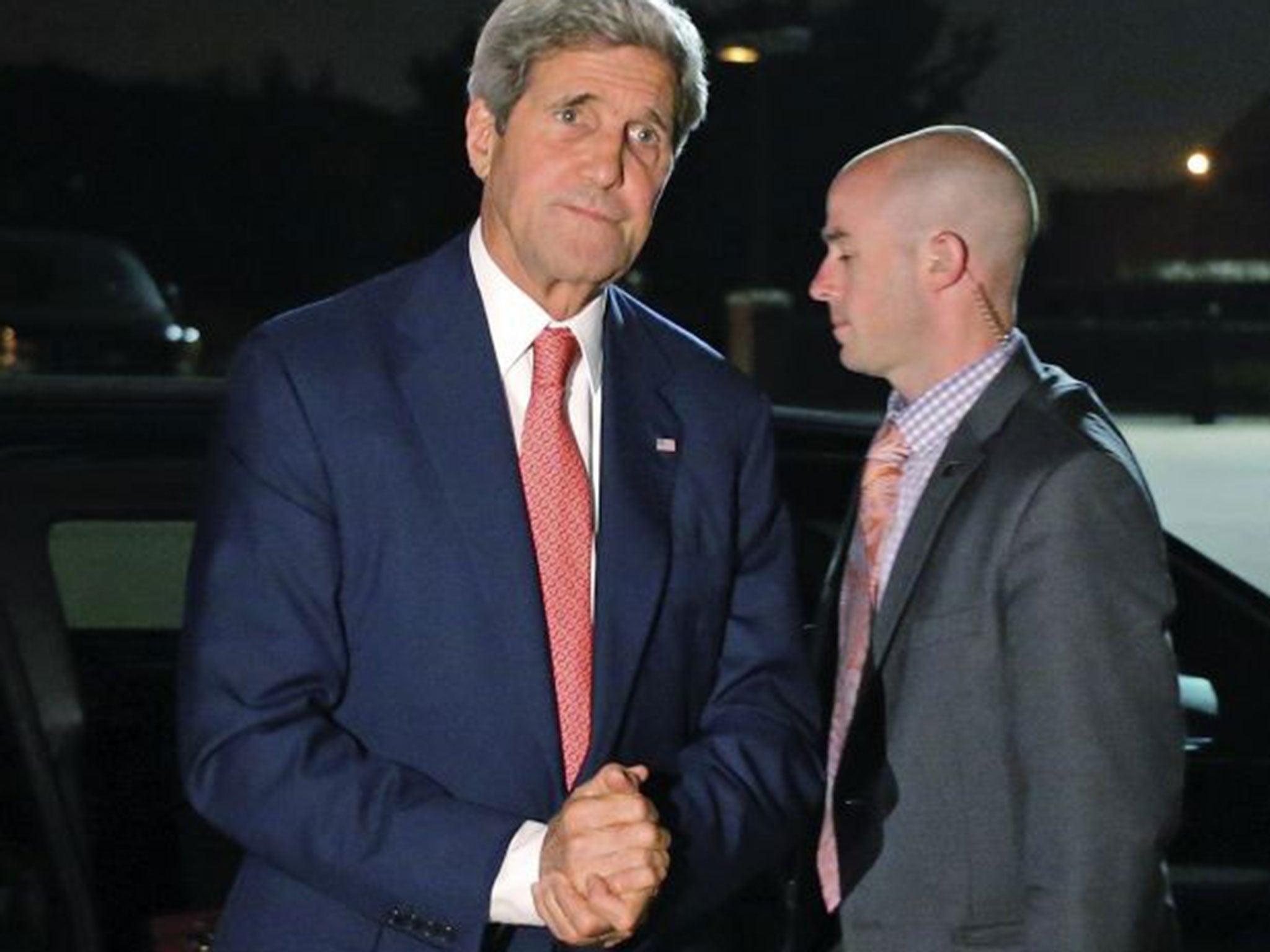 Kerry steps out of his vehicle to board his plane at Andrews Air Force Base as he begins his trip to the Middle East