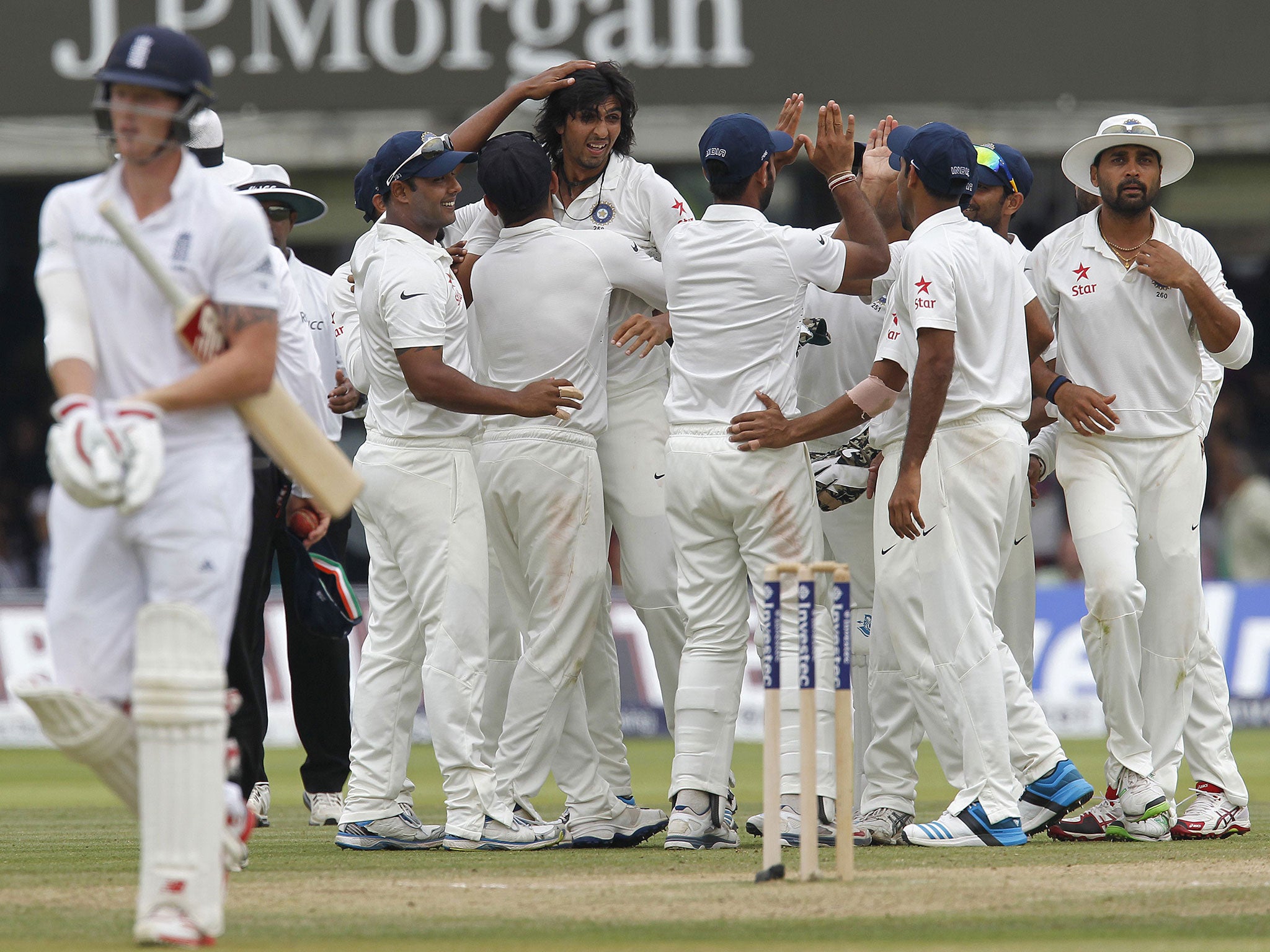 Ben Stokes trudges off after his latest batting failure for England as Ishant Sharma celebrates one of his seven wickets