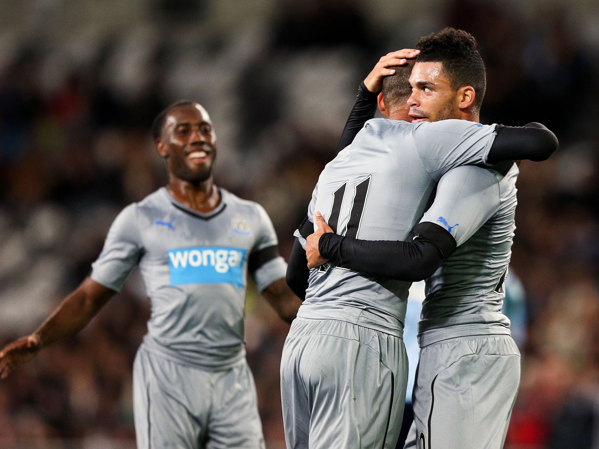 Yoan Gouffran of Newcastle United is congratulated on his goal by Emmanuel Riviere and Vurnon Anita