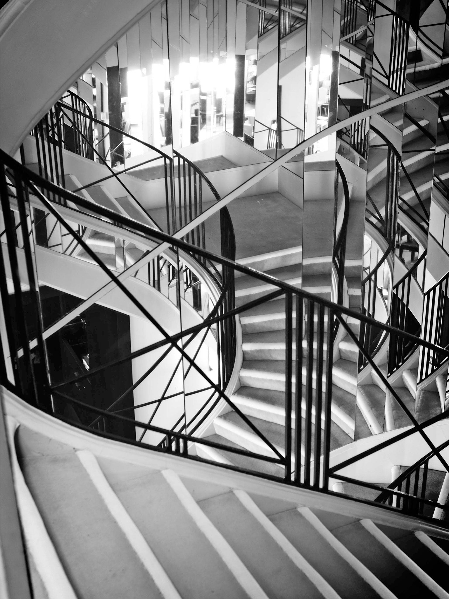 The hallowed mirrored staircase leading up to Coco Chanel's Paris preserved apartment