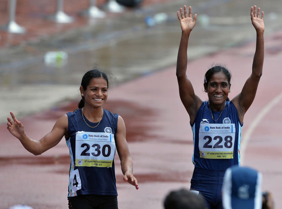 Dutee Chand (l), who has been barred from the Commonwealth Games, waves to the crowd at the 2013 Asian Athletics Championships