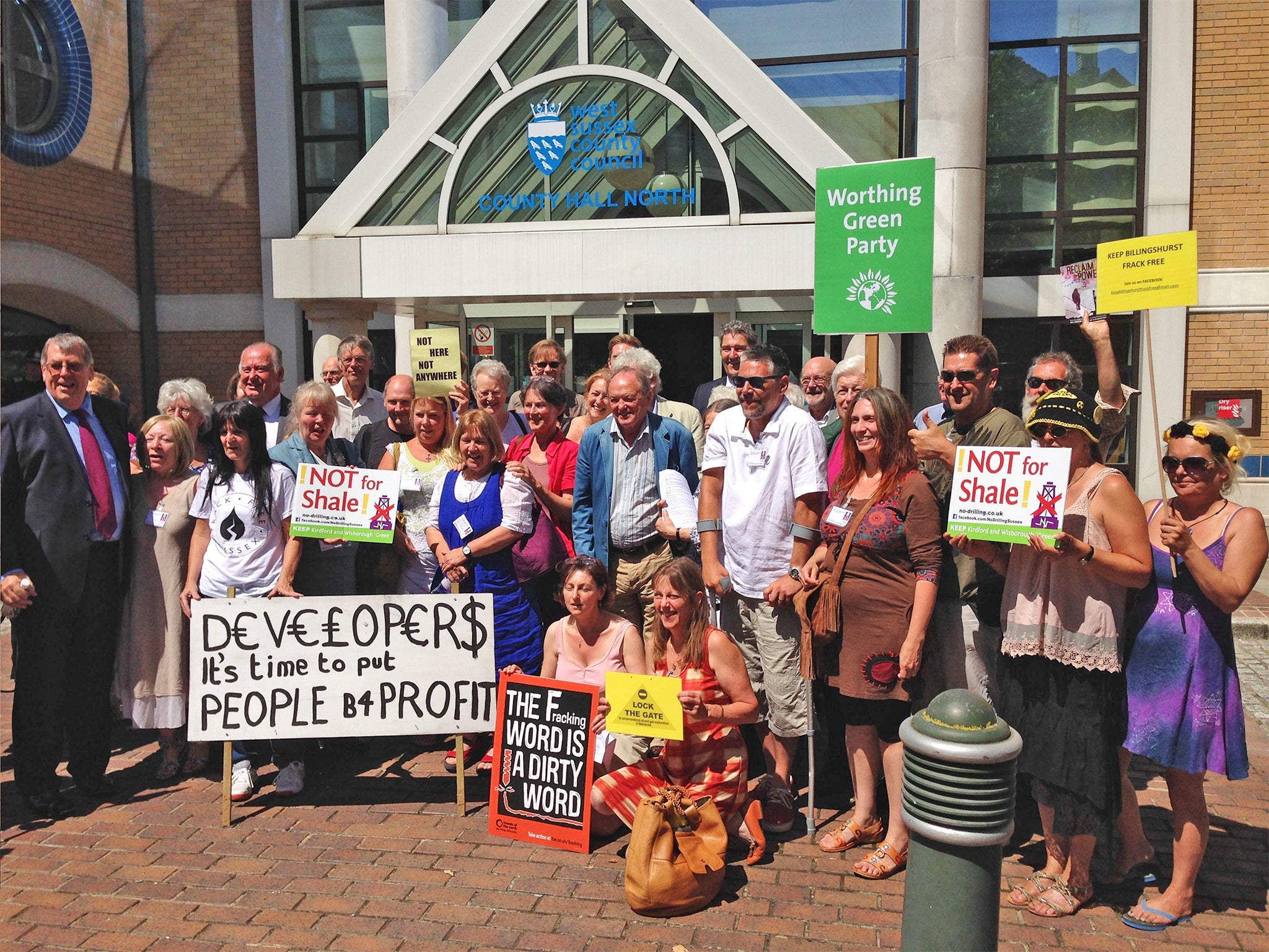 Campaigner celebrate outside West Sussex County Council offices in Horsham after an application by a shale company to explore for oil and gas in a picturesque part of West Sussex has been turned down