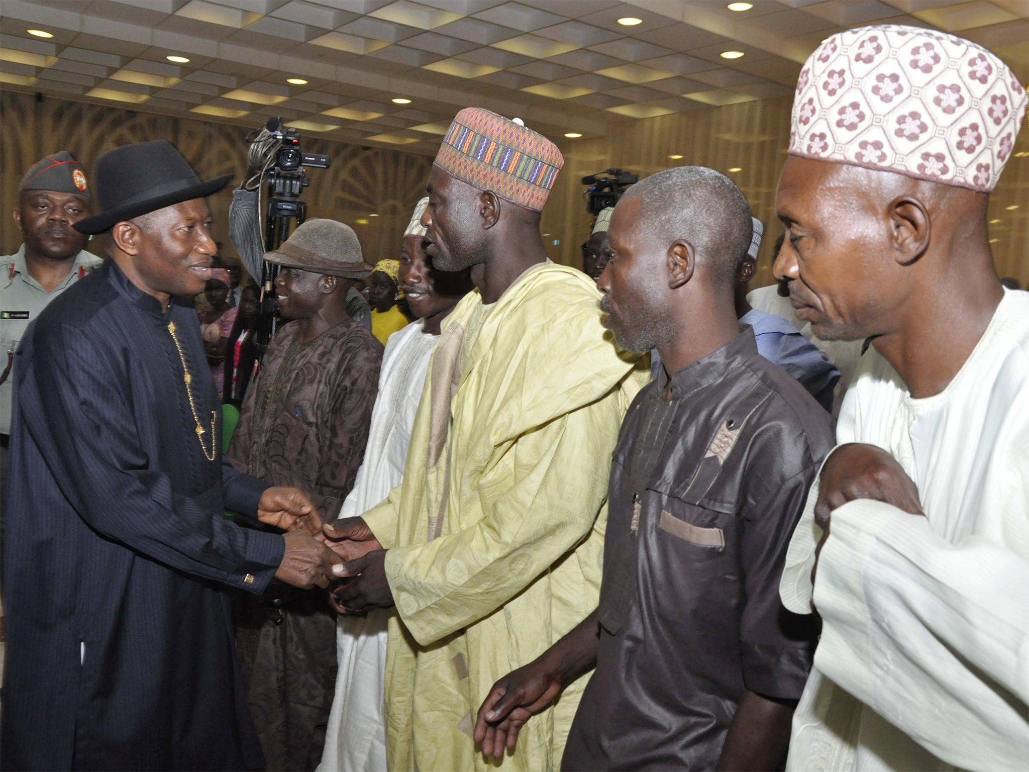 Goodluck Jonathan, left, meets some of the parents of the kidnapped girls in Abuja