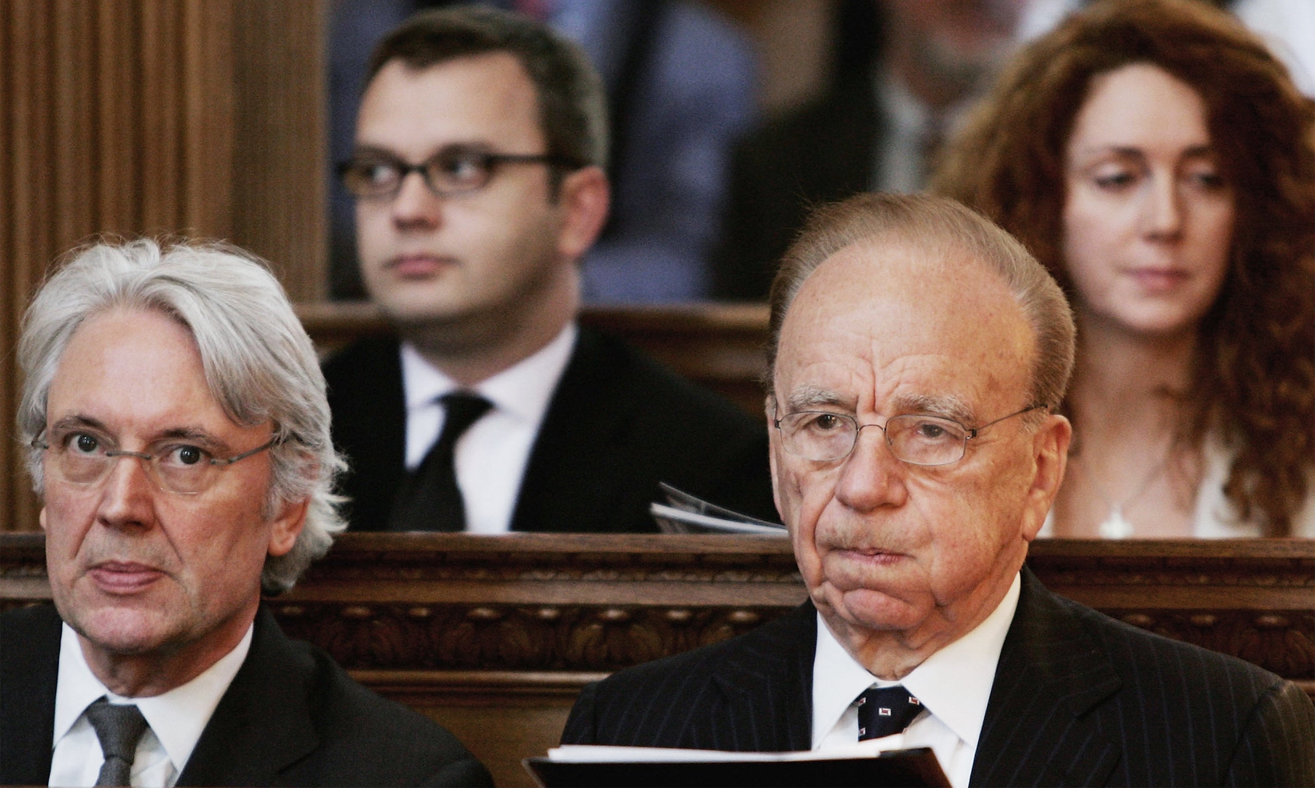Rupert Murdoch with Andy Coulson and Rebekah Brooks behind him in 2005. Next to Murdoch is Les Hinton, then NI chairman