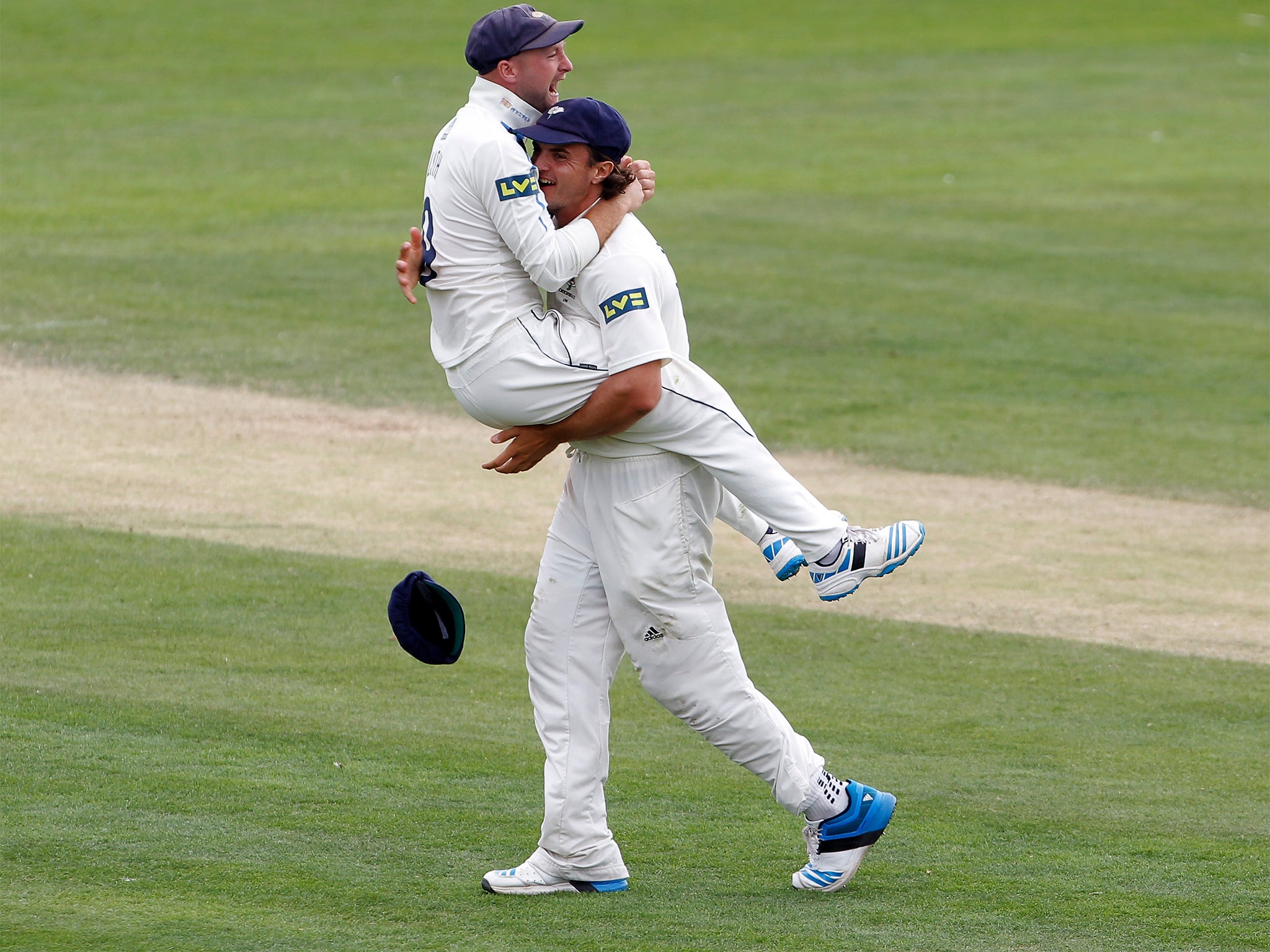 Adam Lyth jumps on Jack Brooks after taking the last wicket
