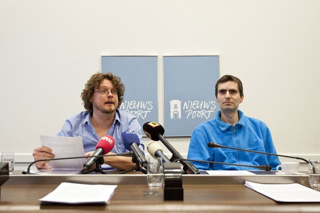 Marthijn Uitenboogaard of MARTIJN, right, and Dutch writer Anton Dautzenberg, a club member, during a press conference in The Hague in March 2012.  