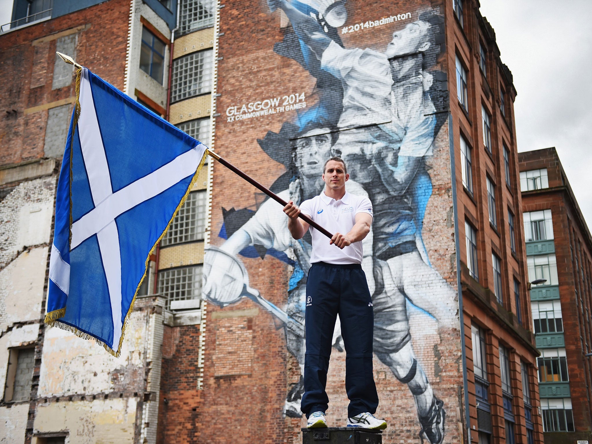 Euan Burton, multiple World and European medal winning judoka poses with the Saltire on 21 July, 2014 in Glasgow, Scotland