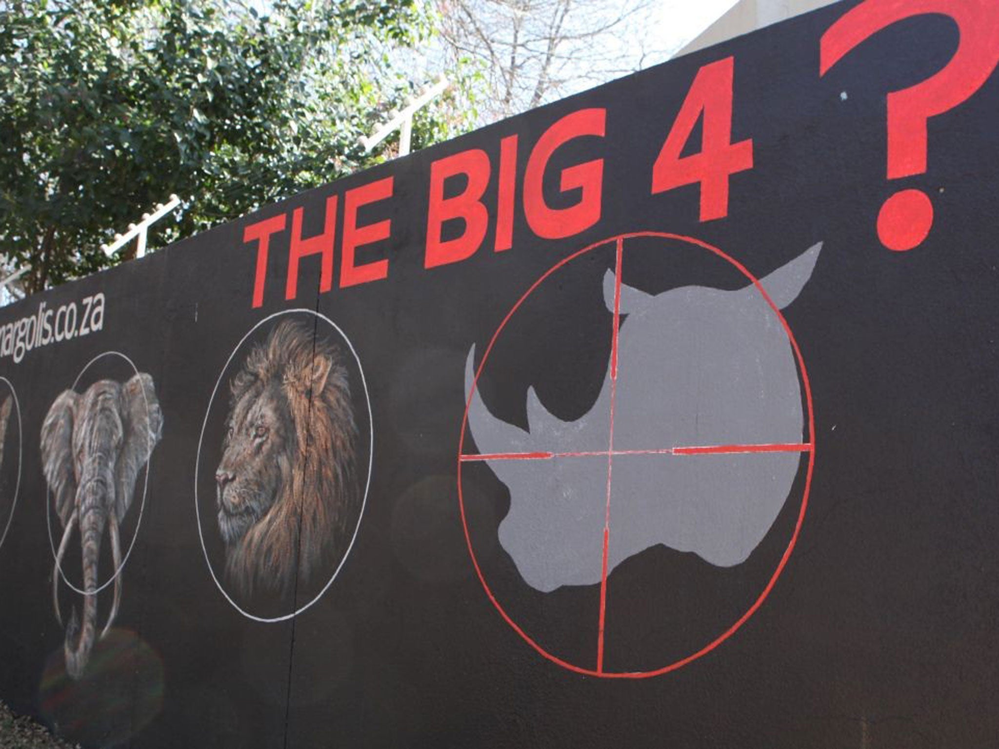 A mural painted on a suburban wall in Johannesburg, South Africa calls for the halt to rhino poaching