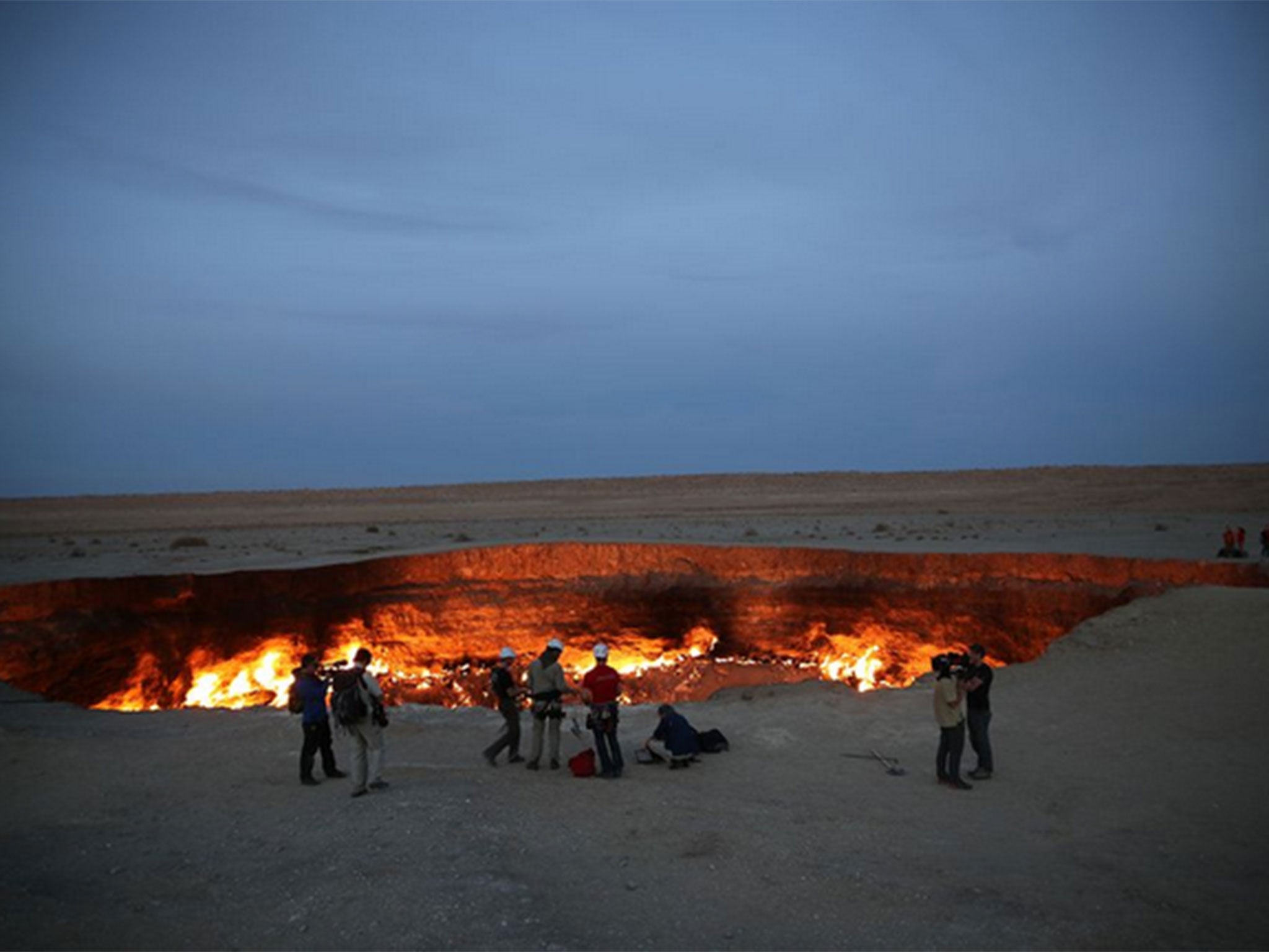 The Darvaza Crater found in northern Turkmenistan, known as the 'Door to Hell', is 225 ft wide and 99 ft deep, and filled with burning methane gas.