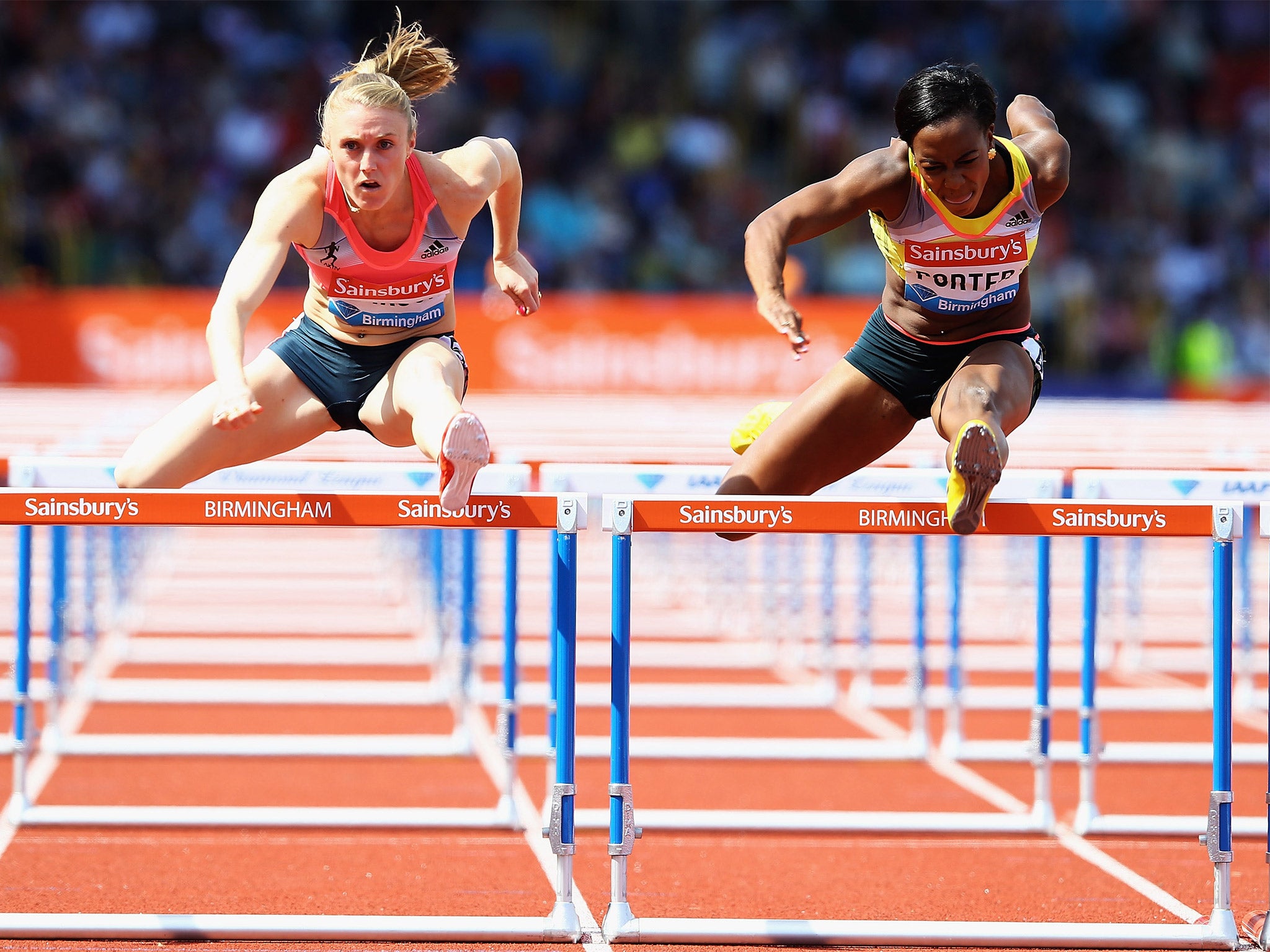 Australia’s Sally Pearson (left) takes on Tiffany Porter, of England, (right) in the 100m hurdles