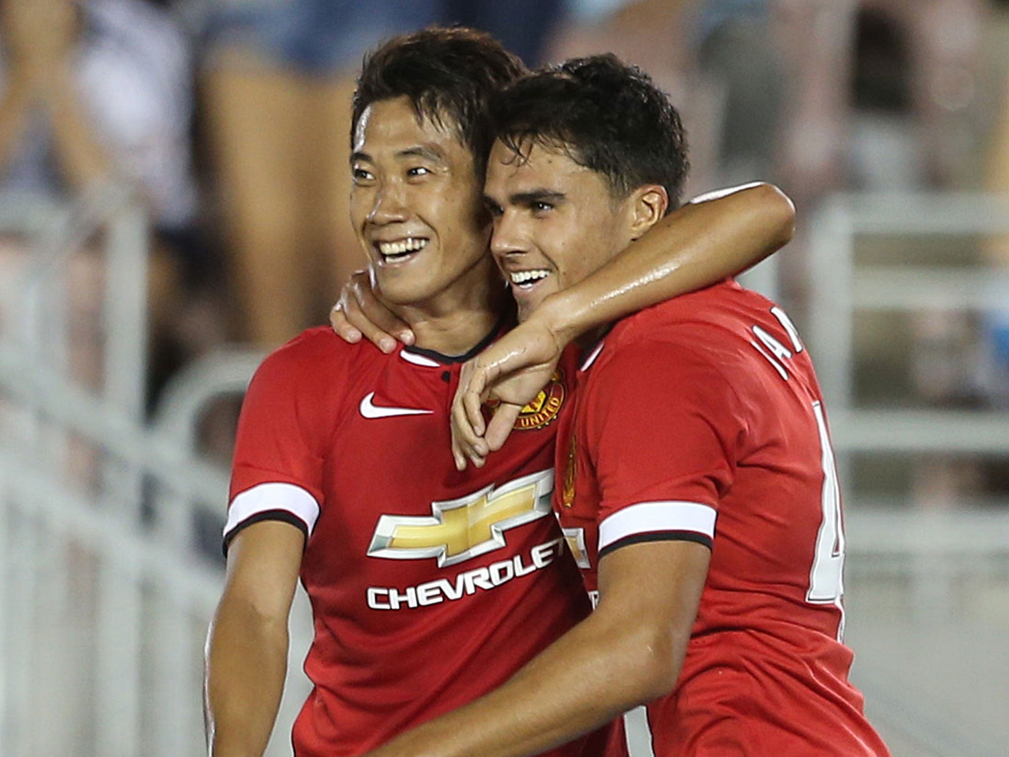Shinji Kagawa and Reece James celebrate after the latter scores in Manchester United's 7-0 victory over LA Galaxy