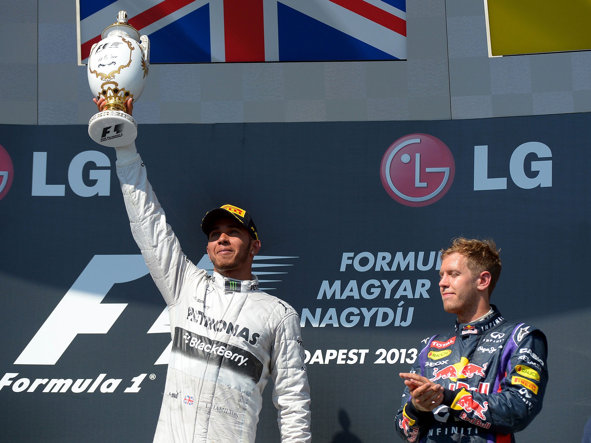 Lewis Hamilton celebrates winning the 2013 Hungarian Grand Prix