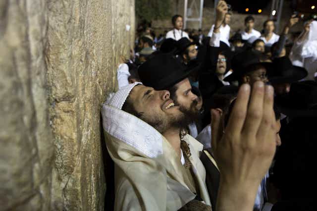 A Jewish worshipper takes part in a special prayer at the Western Wall in Jerusalem's Old City for the well-being of Israeli soldiers in Gaza 