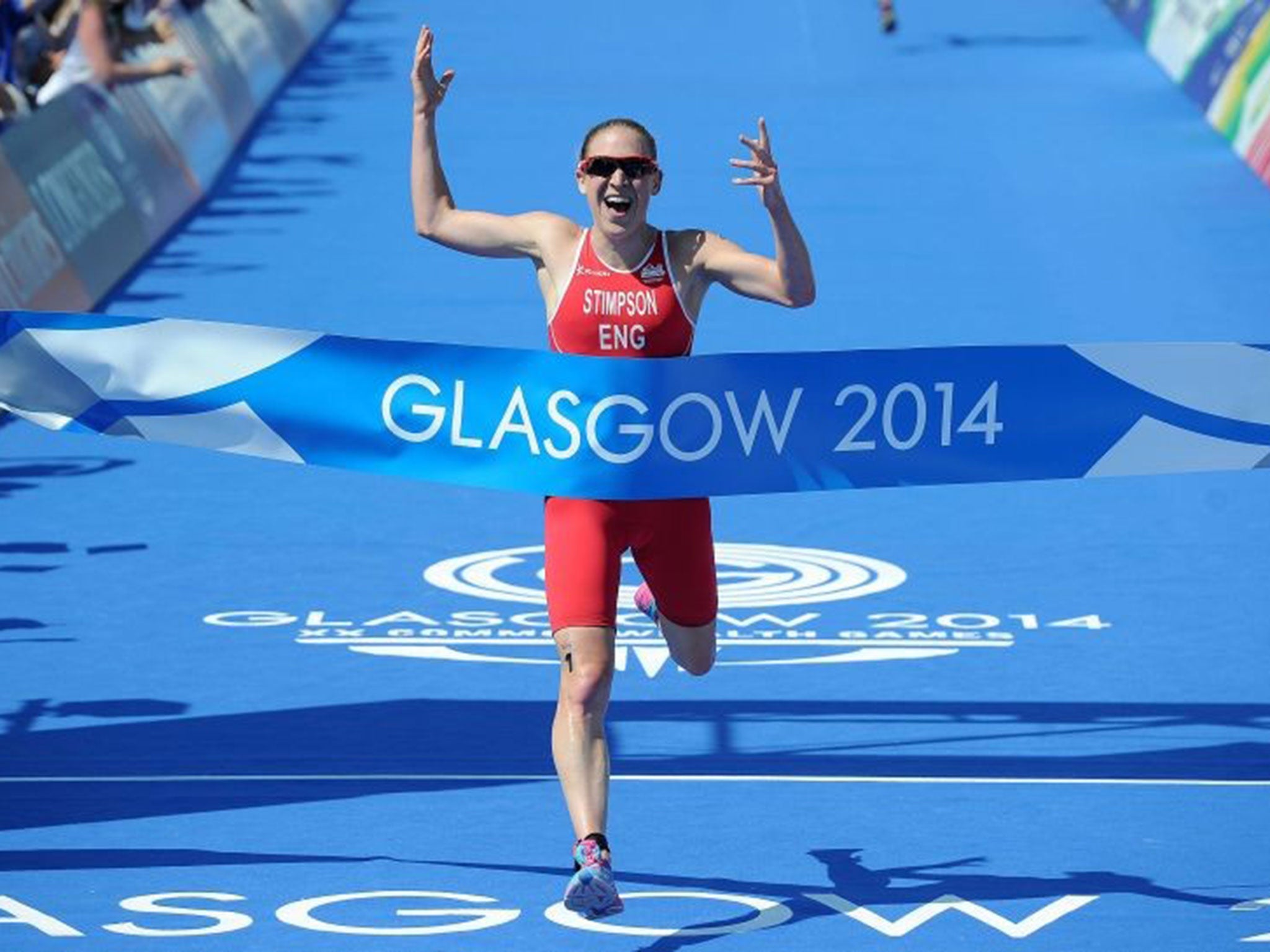 Jodie Stimpson crosses the finishing line to win gold in the women's triathlon