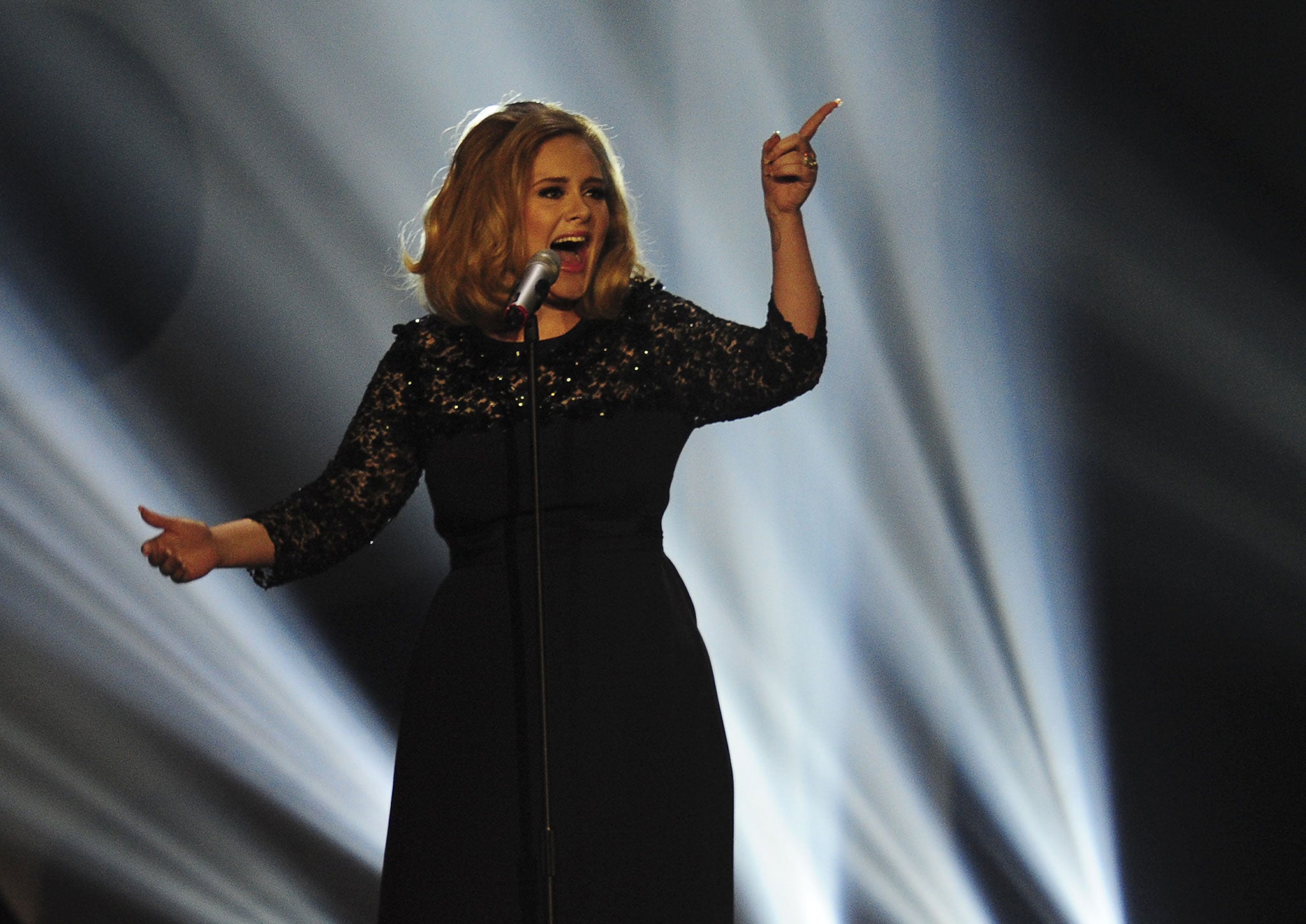 Adele performs on stage at the BRIT Awards 2012