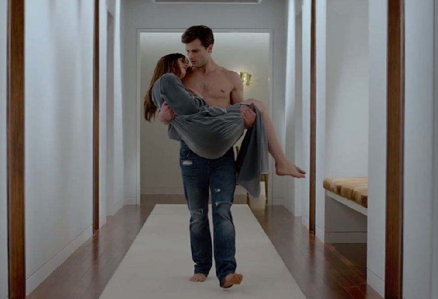 Christian Grey cradles Anastasia in the trailer (Picture: Universal)