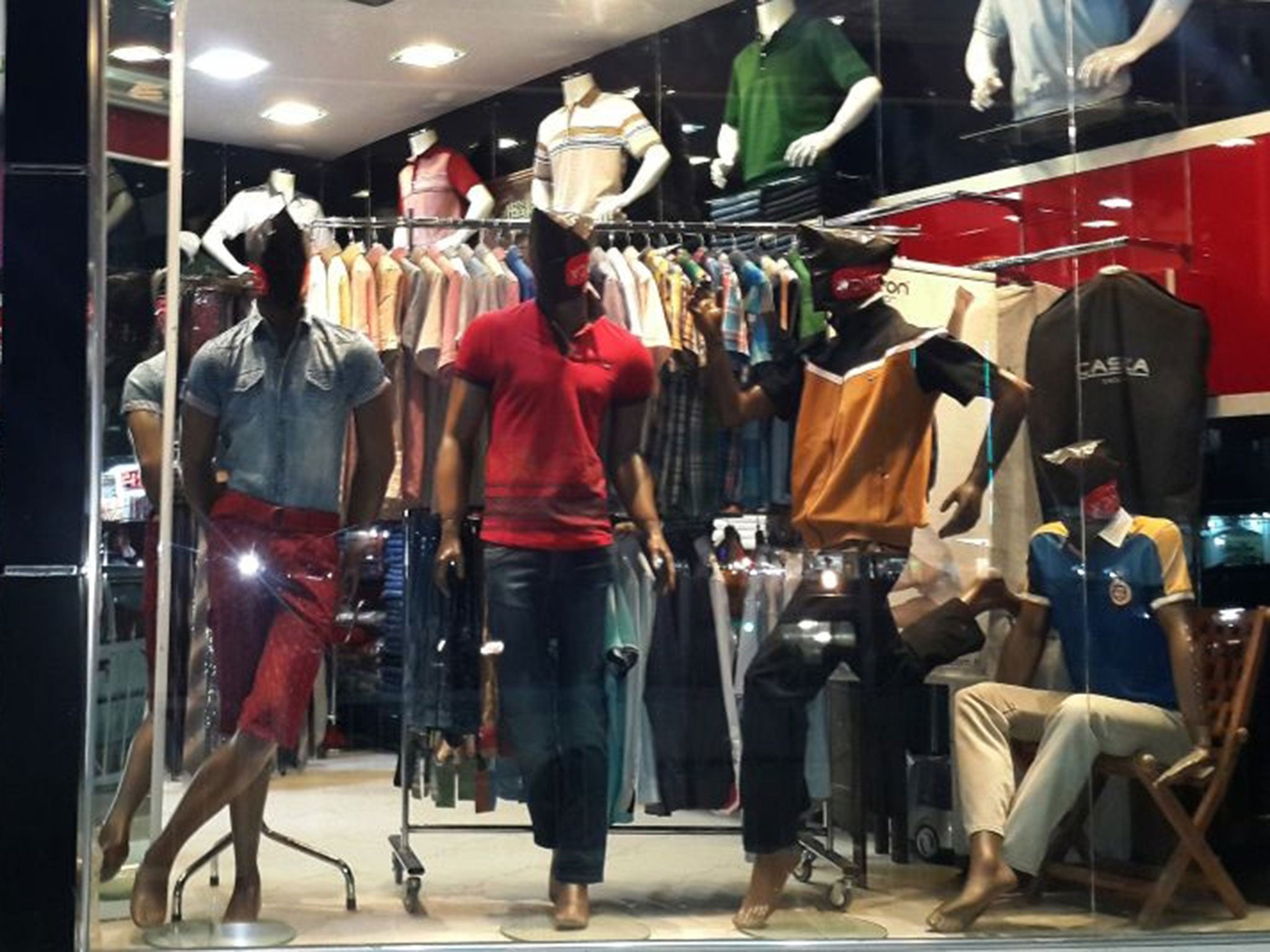 Mannequins with their faces covered are displayed in a shop window in central Mosul, 225 miles (360 kilometers) northwest of Baghdad, Iraq. (AP)