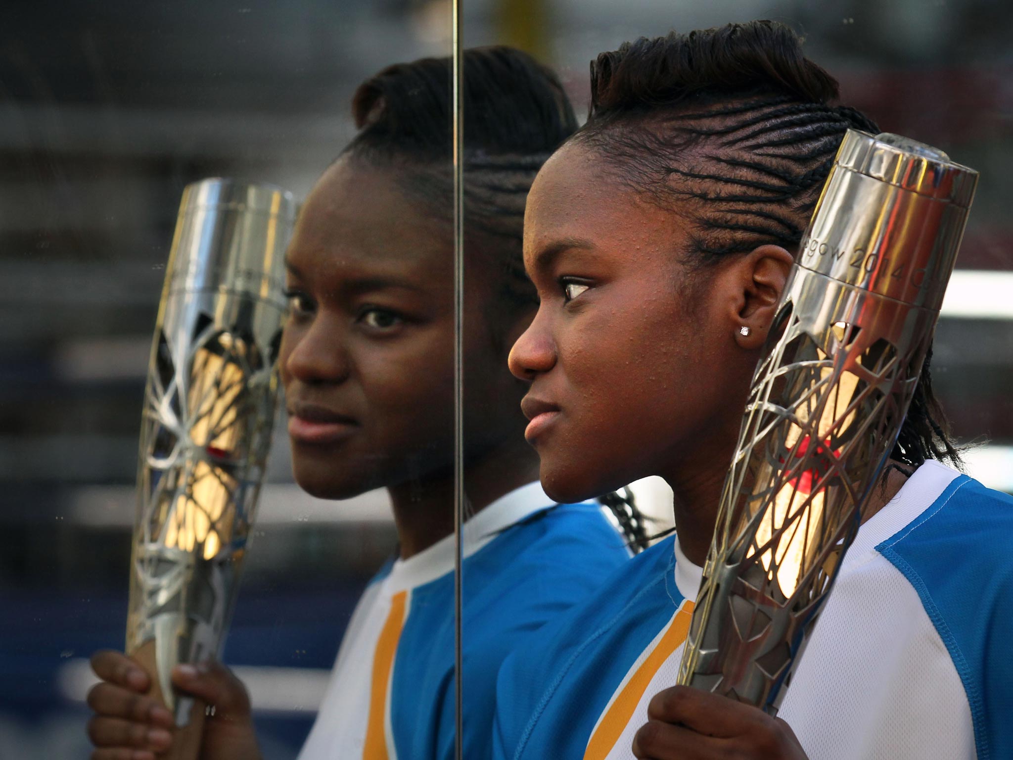 Olympic champion Nicola Adams gets to grips with the Queen’s baton