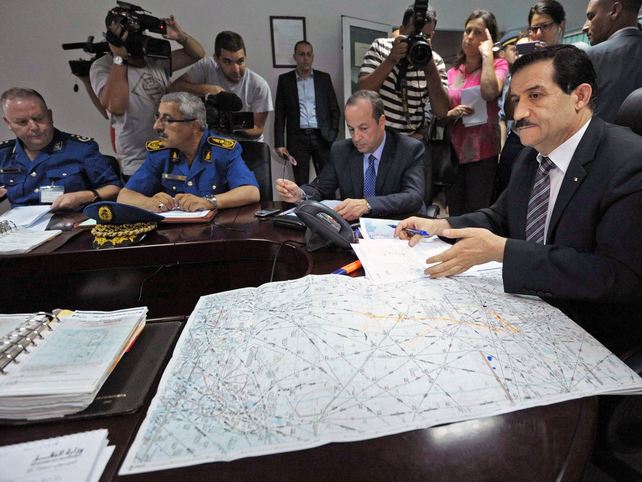 Algerian Minister of Transport Amar Ghoul (R) chairs an Algerian crisis unit meeting at the Houari-Boumediene International Airport in Algiers, Algeria, 24 July 2014