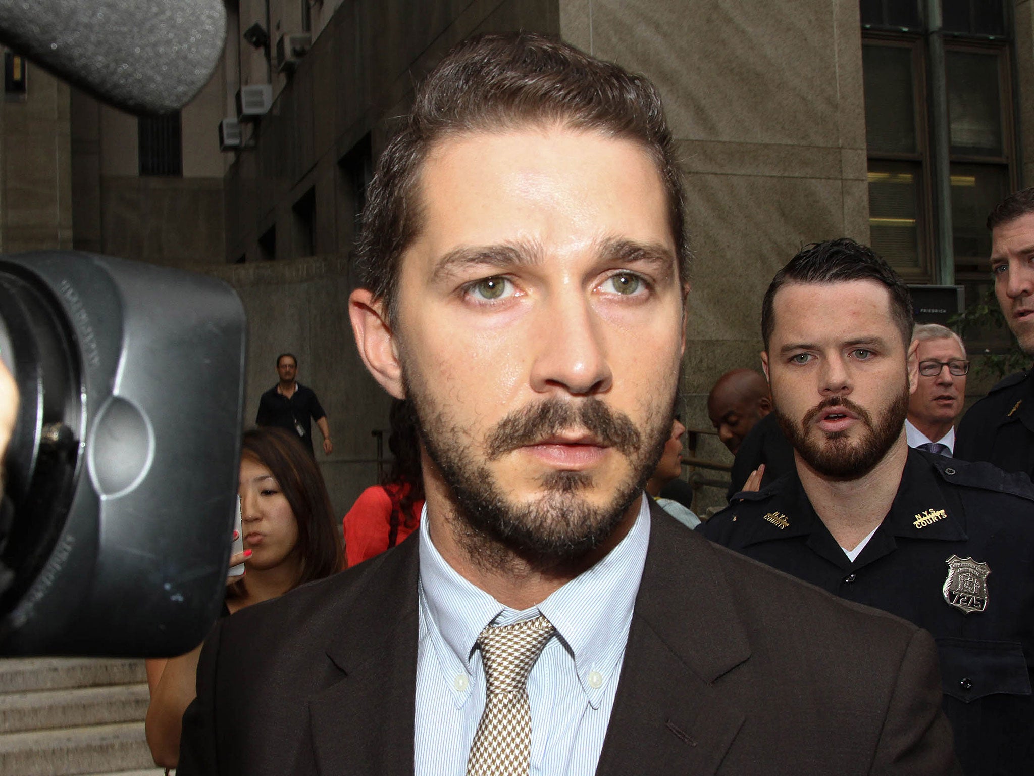 Shia LaBeouf leaves court on 24 July, 2014, in New York City