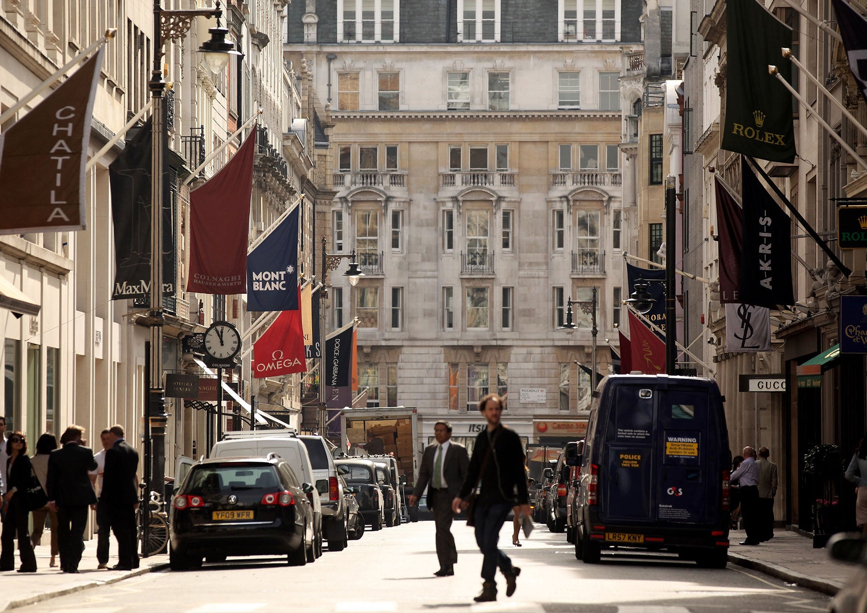 Shoppers walk along New Bond Street in Mayfair