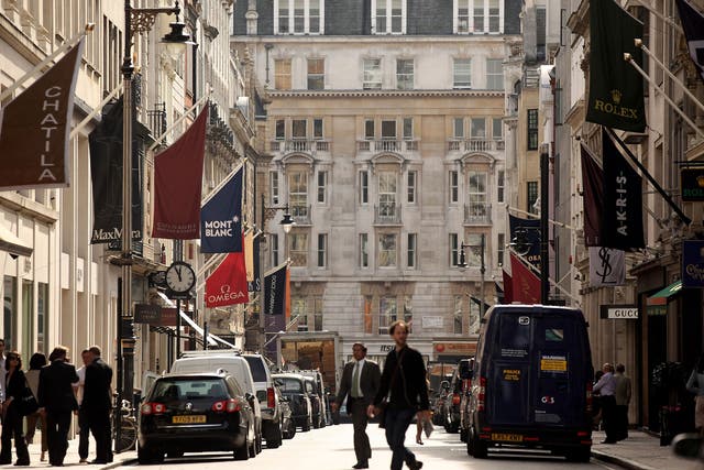 Shoppers walk along New Bond Street in Mayfair 