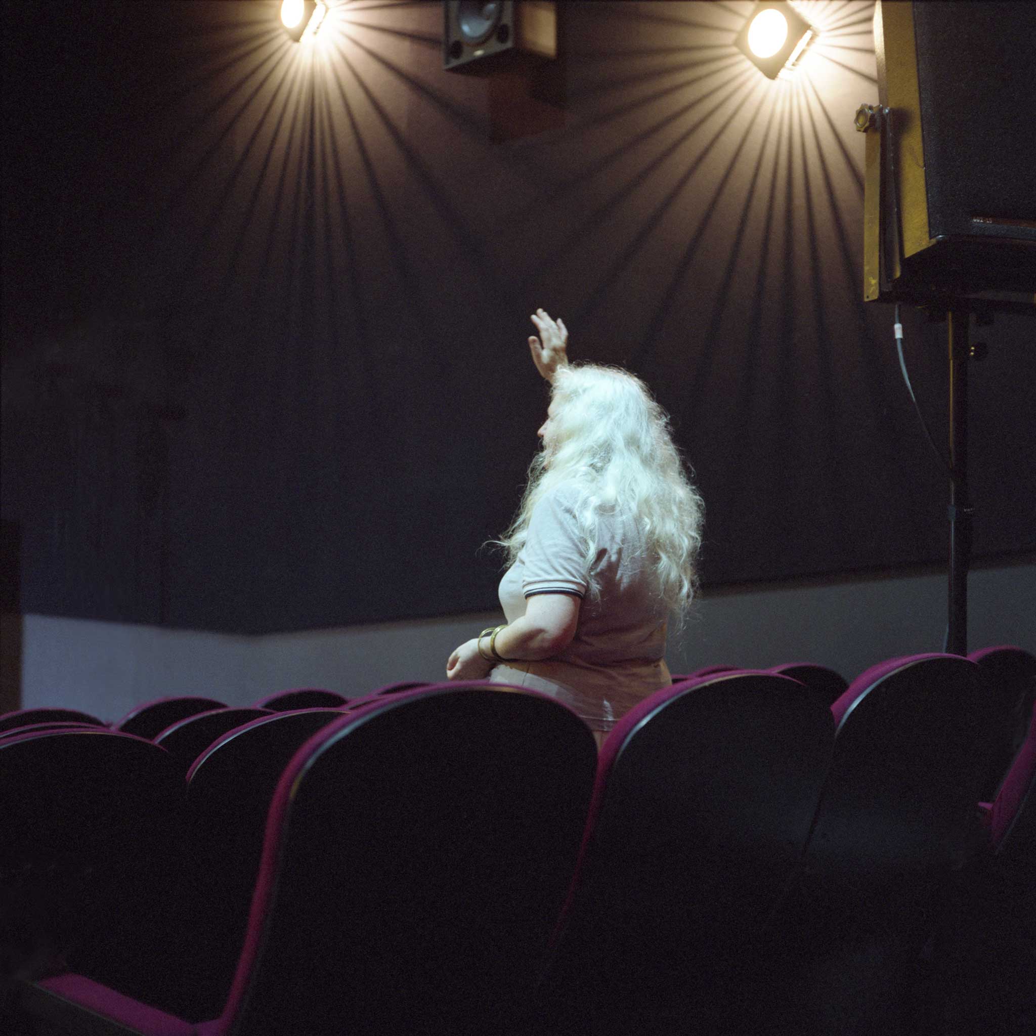 A woman is pictured during an Ivy Church worship in a Manchester cinema