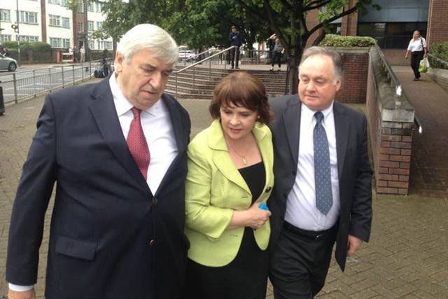 John Brown (right) with his sister, Eurovision Song Contest winner and former Irish presidential candidate Dana Rosemary Scallon, and her husband Damien Scallon, as he leaves Harrow Crown Court after he was found not guilty of five counts of historic sex 