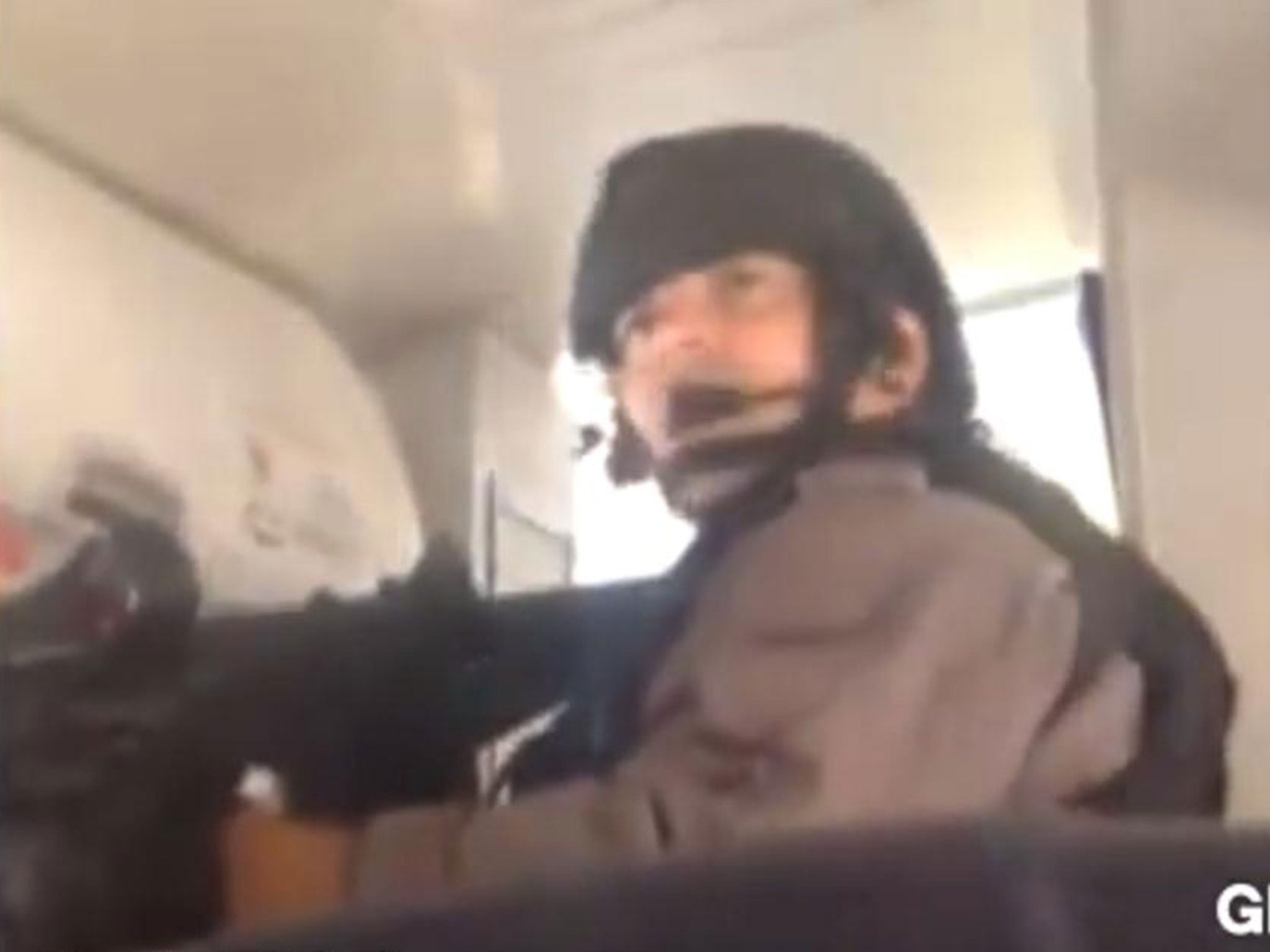 A video shot by a passenger showed armed Canadian law enforcement officers shouting "heads down, hands up" as they stormed aboard the aircraft in helmets and tactical gear