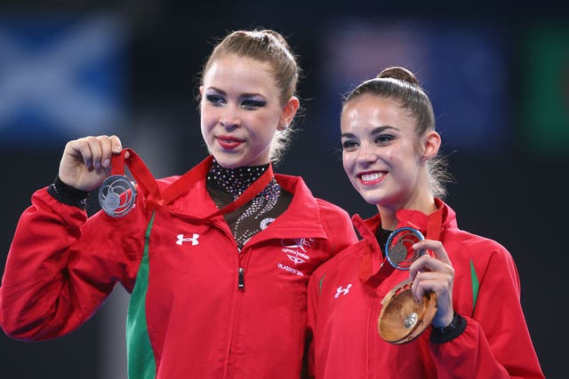 Silver medallist Francesca Jones (L) of Wales embraces bronze medallist Laura Halford (R)