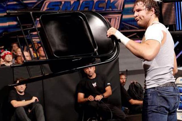 Dean Ambrose uses a chair during his match against Cesaro