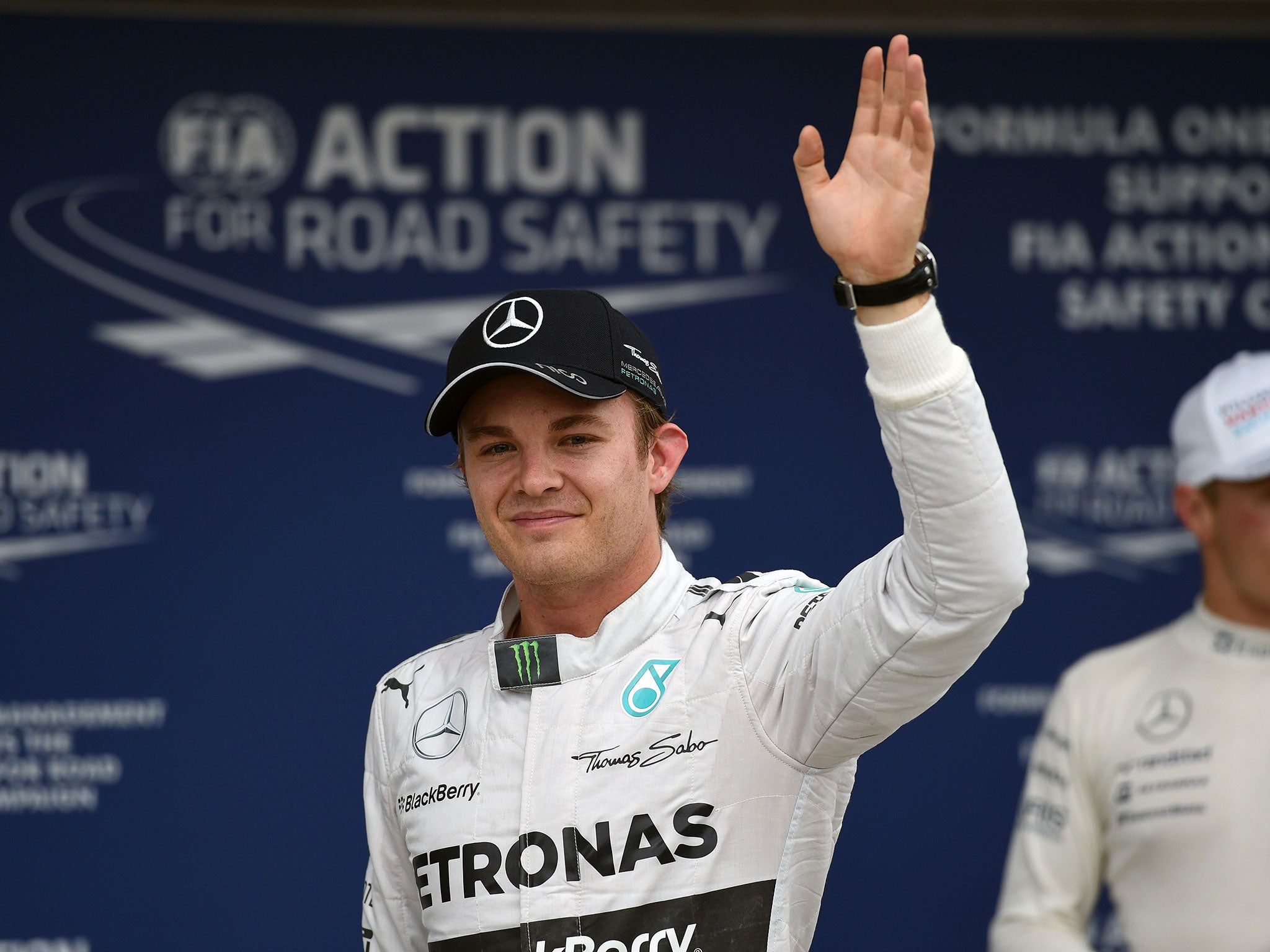 Nico Rosberg celebrates putting his Mercedes on pole after a dramatic qualifying session