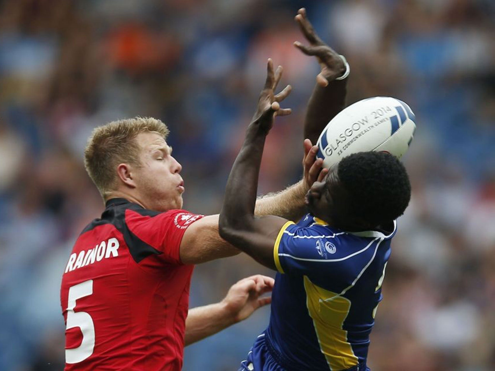 Canada and Barbados tussle for the ball